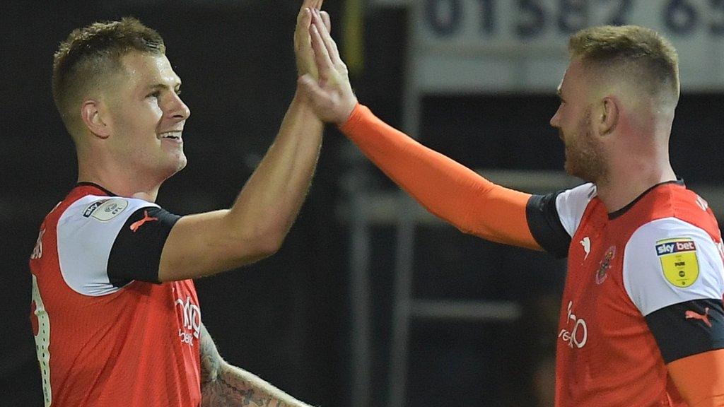 Luton's James Collins celebrates a goal