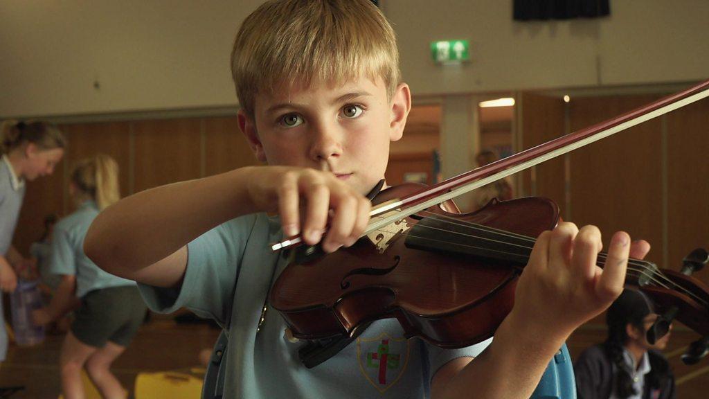 boy playing violin