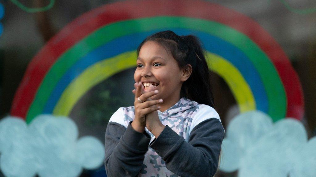 Girl clapping for the NHS