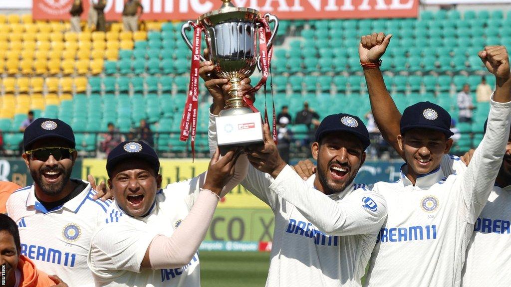 India celebrate with the Test series trophy