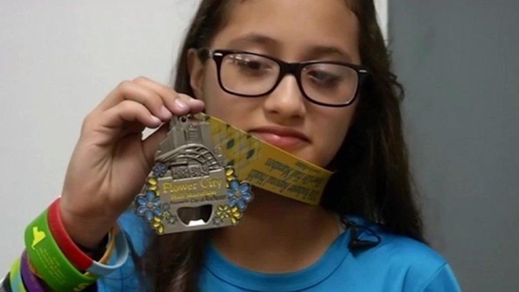 Lee holding her medal