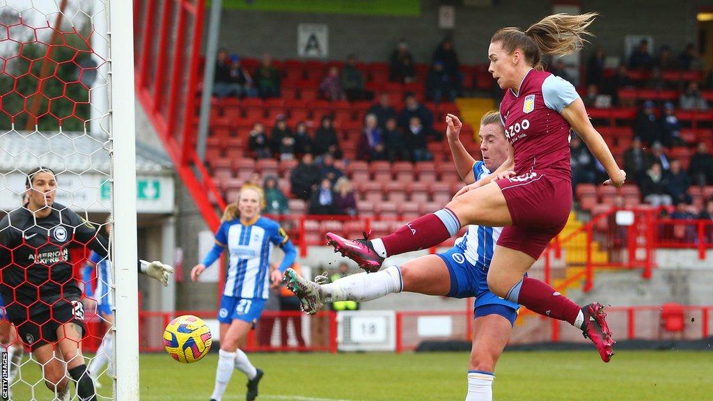 Kirsty Hanson of Aston Villa scores their sides second goal during the FA Women's Super League match between Brighton & Hove Albion and Aston Villa at Broadfield Stadium on February 12, 2023 in Crawley