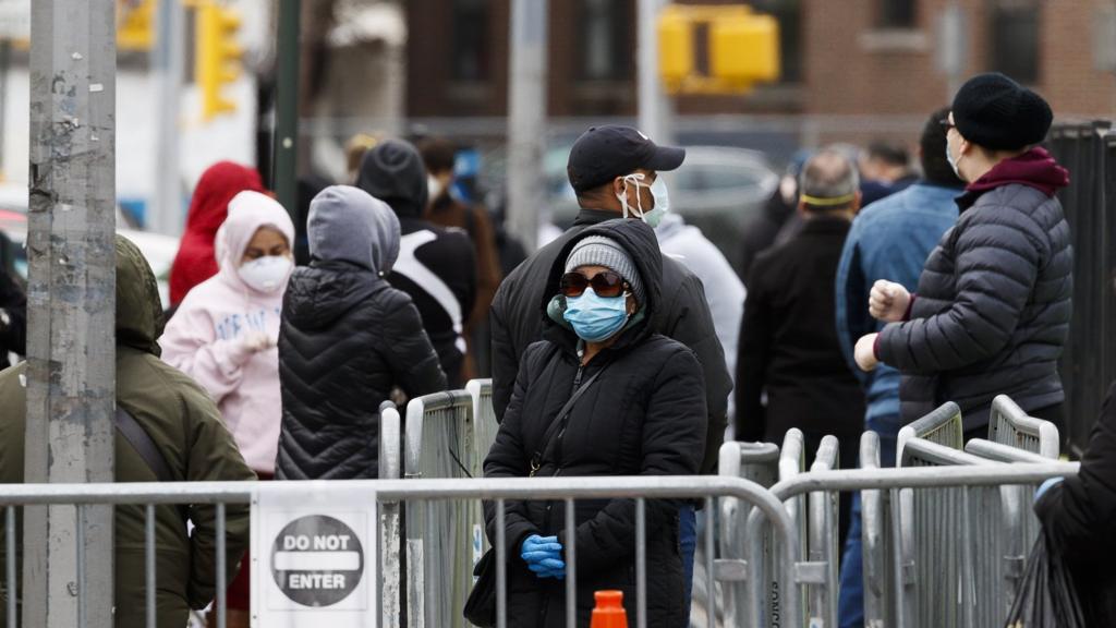 People queue outside a coronavirus testing area in New York