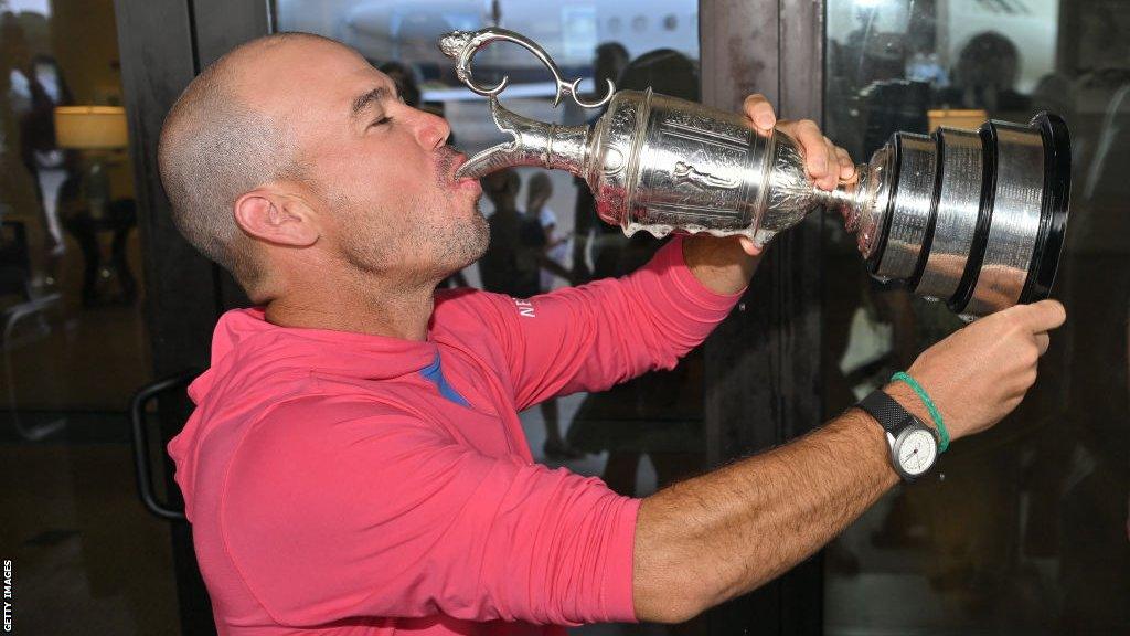 Brian Harman drinking from the Claret Jug on his return to Georgia in the United States