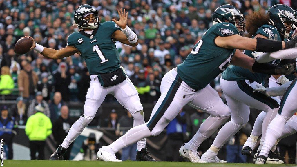 Jalen Hurts prepares to throw the ball while playing for the Philadelphia Eagles