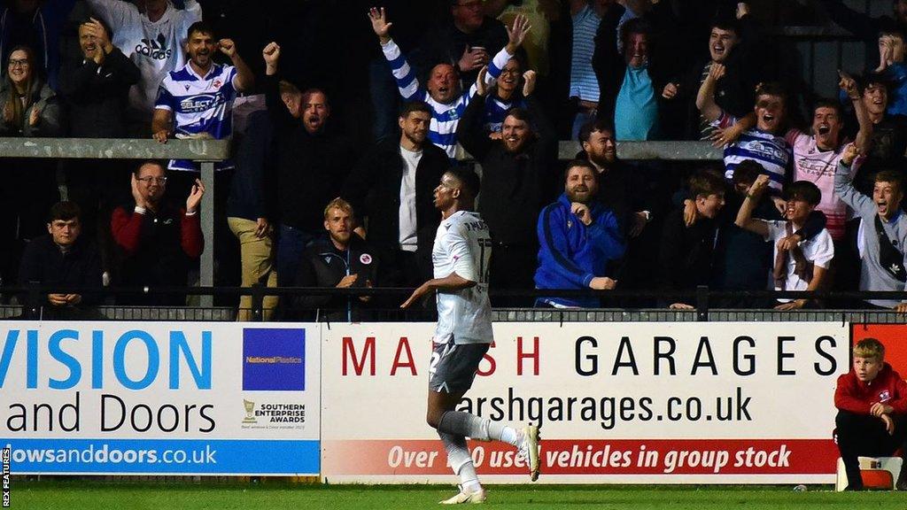 Reading players celebrate scoring against Exeter City in the EFL Trophy.