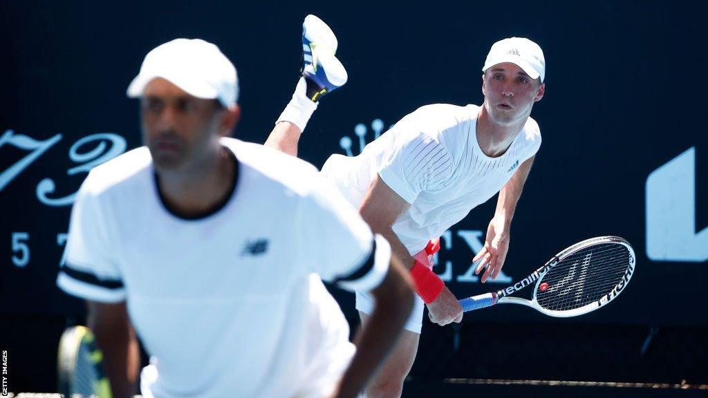 Joe Salisbury serves with Rajeev Ram in the foreground