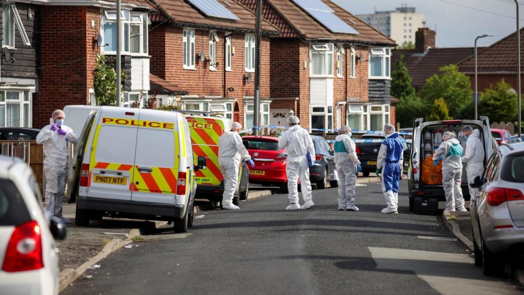 Forensic teams outside the house