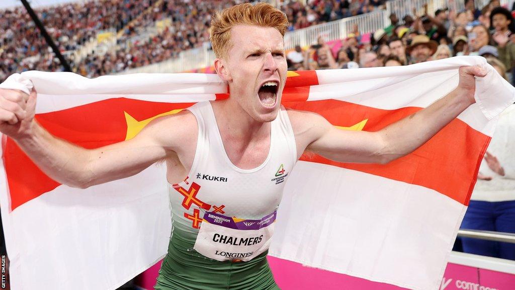 Alastair Chalmers celebrates a bronze medal