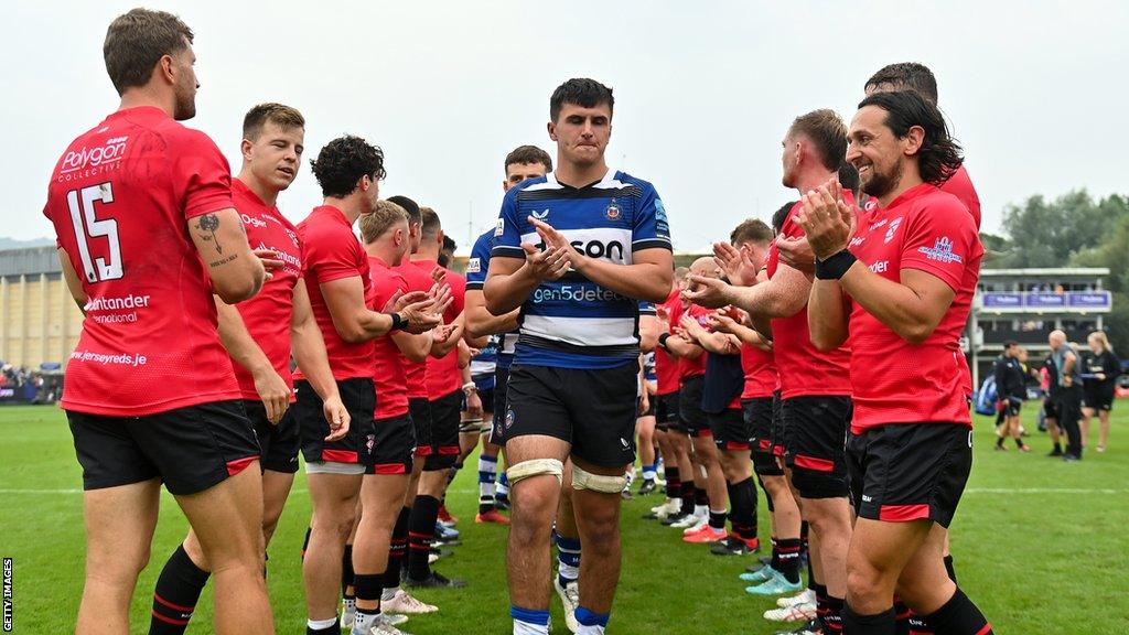 Jersey players clap off Bath's players