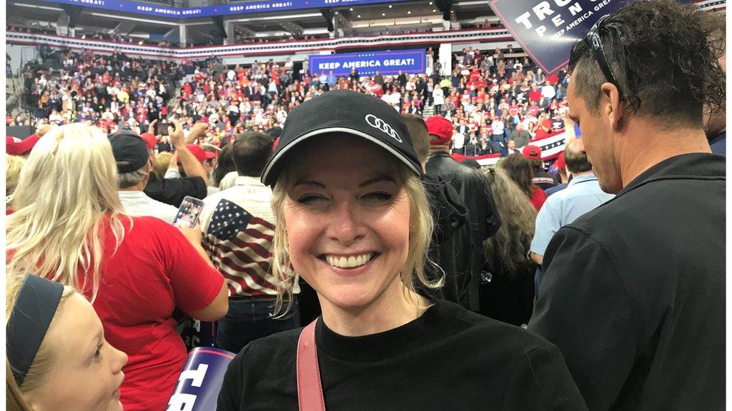 Christine Bowers is one of the few in the crowd who is not a hardcore Trump supporter