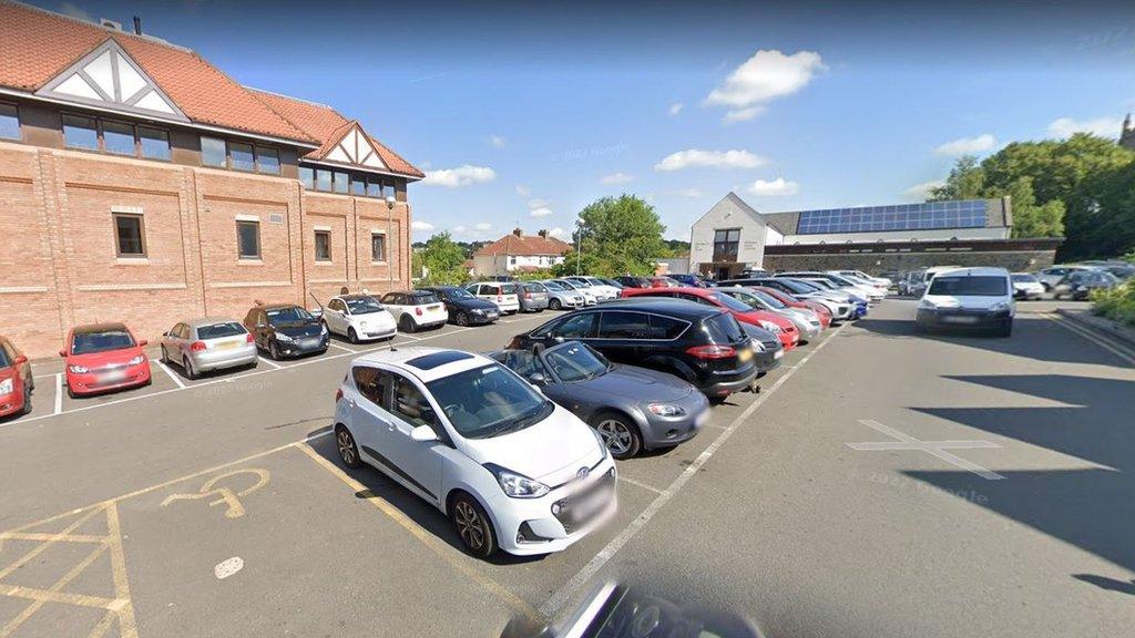 Westbury Hill car park in Westbury-on-Trym, with the GP surgery at the rear