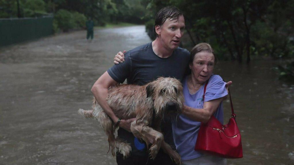 People in Houston escape floodwaters