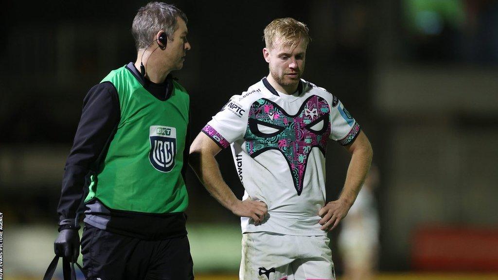 Ospreys wing Mat Protheroe being led off the field after being shown a red card against Dragons