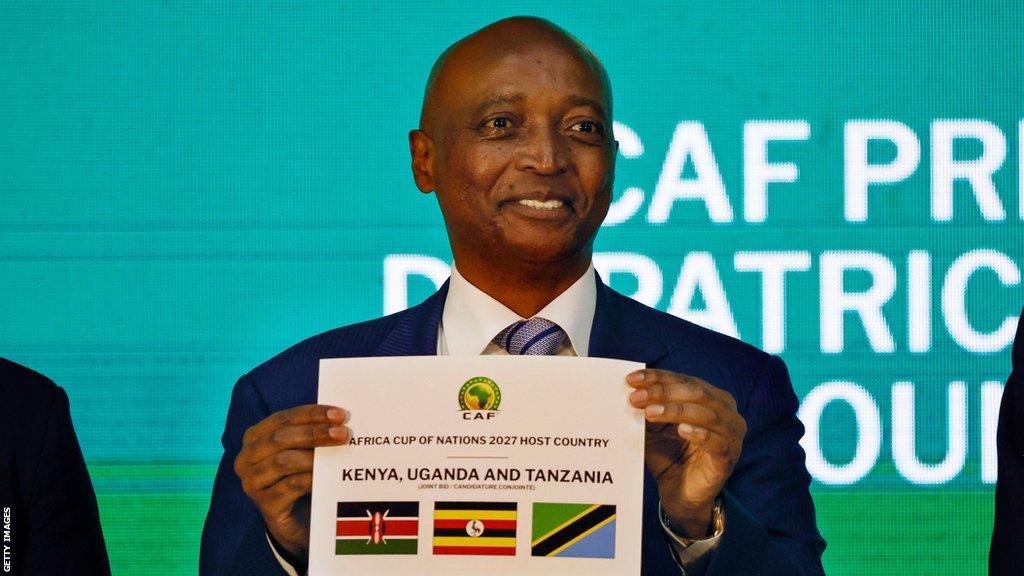 Patrice Motsepe, president of the Confederation of African Football, announces Kenya, Uganda and Tanzania as the host countries for the 2027 Africa Cup of Nations during a ceremony held in Cairo