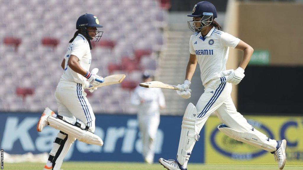 Yastika Bhatia (left) and Harmanpreet Kaur (right) running between the wickets