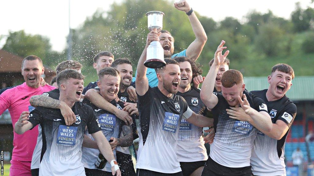 Haverfordwest players celebrate victory over Newtown in the play-offs.