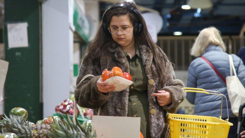 Woman shopping for vegetables