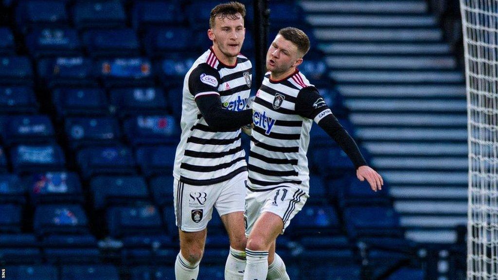 Queen's Park players celebrate