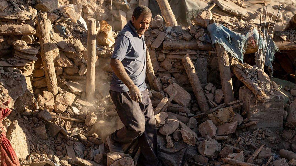 A rescue worker in the rubble