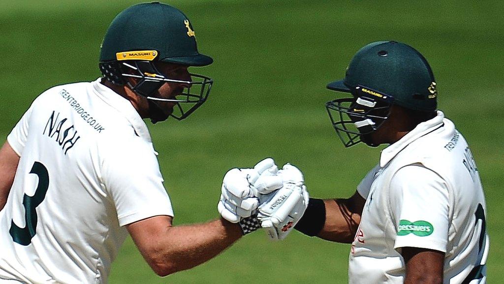 Nottinghamshire batsmen Chris Nash and Samit Patel touch gloves