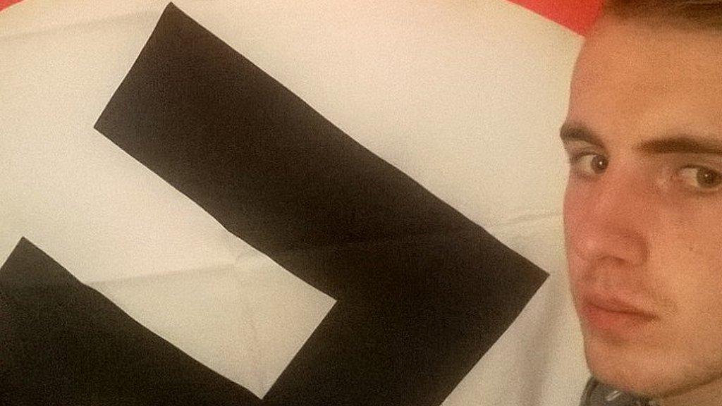 Ethan Stables and his prized swastika flag