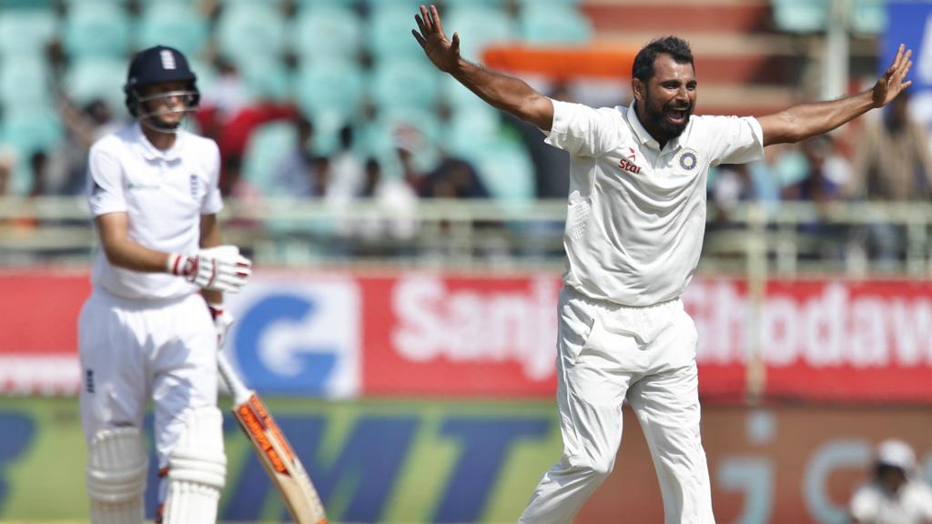 India's Shami celebrates the wicket of Joe Root