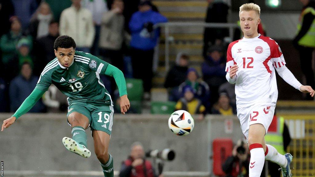 Shea Charles in action during NI's 2-0 win over Denmark in November as Kasper Dolberg looks on