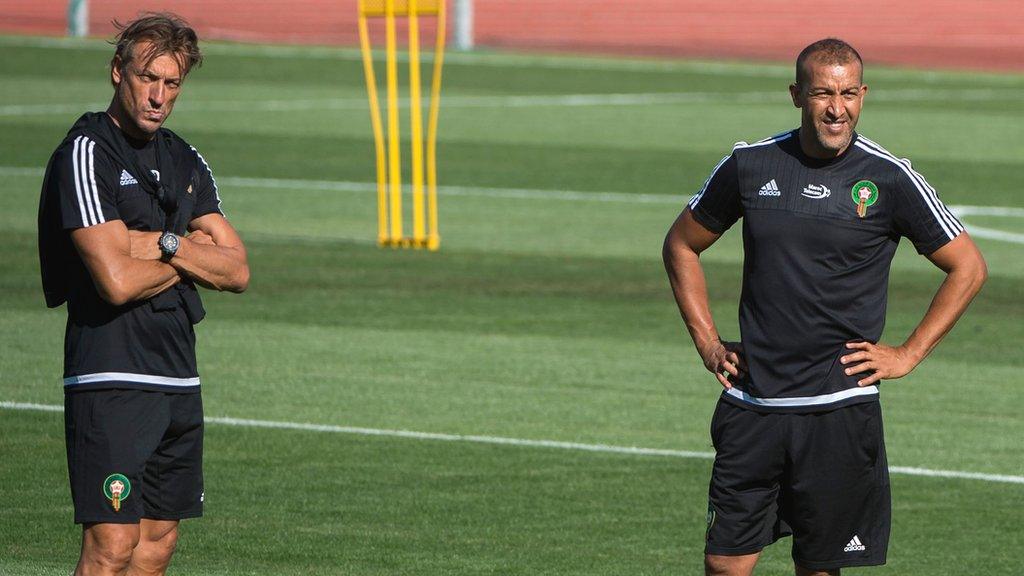 Mustapha Hadji and Herve Renard stand together as part of Morocco coaching staff