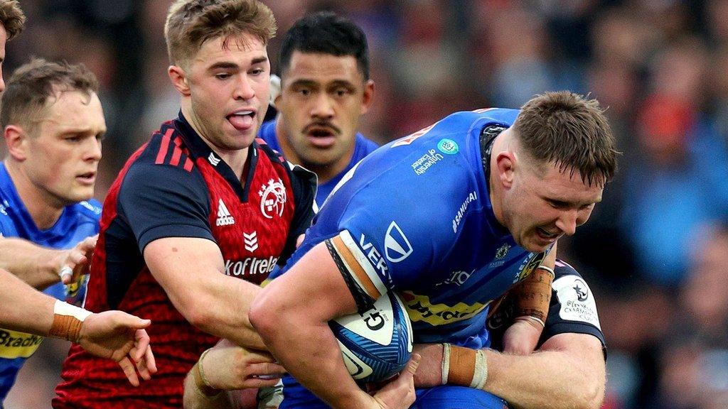 Exeter's Lewis Pearson is tackled by Munster pair Jack Crowley and John Hodnett