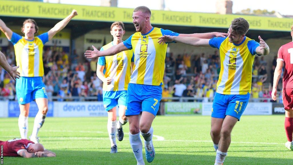 Torquay United celebrate scoring the winner against Chelmsford