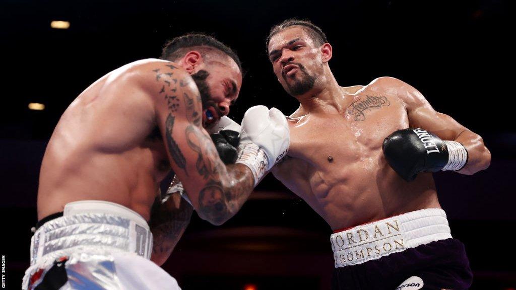 Jordan Thompson throws a punch at Luke Watkins during the cruiserweight contest in Cardiff fin April