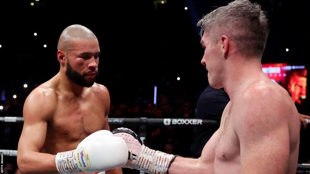 A bruised Chris Eubank Jr fist bumps Liam Smith in the ring