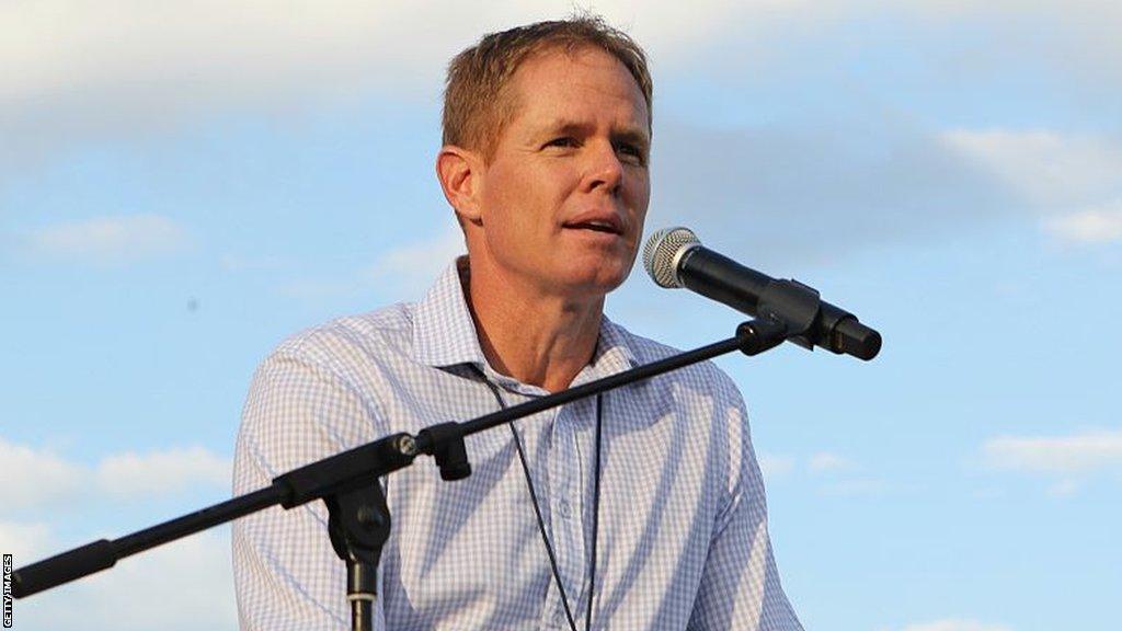 South Africa cricket legend Shaun Pollock speaking into a microphone