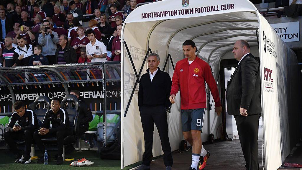 Jose Mourinho, Manager of Manchester United and Zlatan Ibrahimovic of Manchester United make their way out of the tunnel during the EFL Cup Third Round match between Northampton Town and Manchester United at Sixfields on September 21, 2016