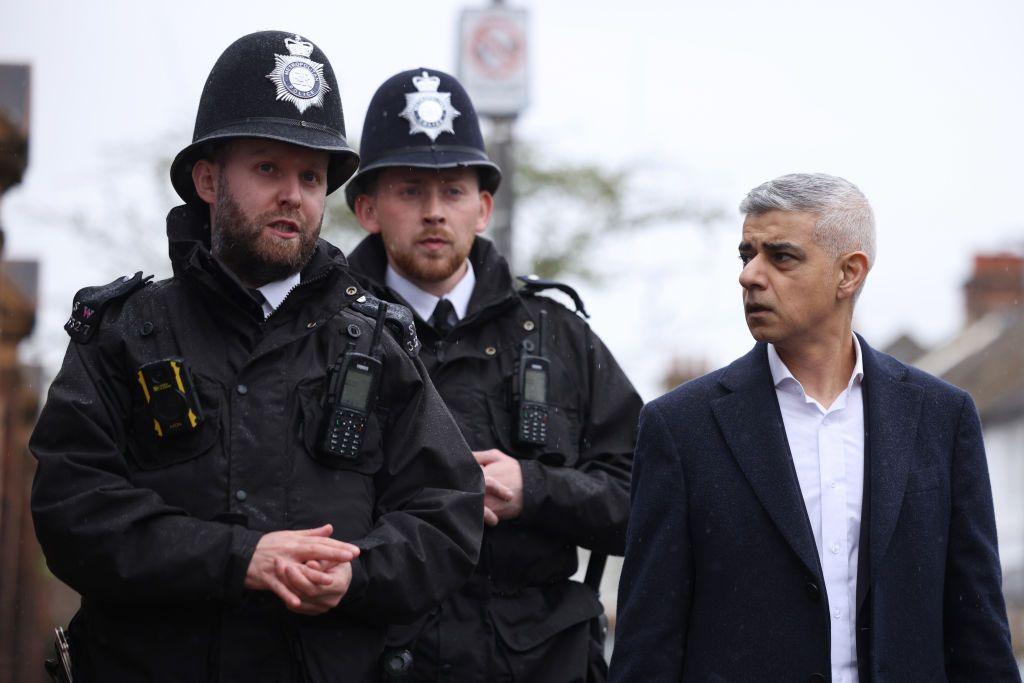London Mayor Sadiq Khan walks and speaks with police officers in Earlsfield on March 26, 2024 in London, England.
