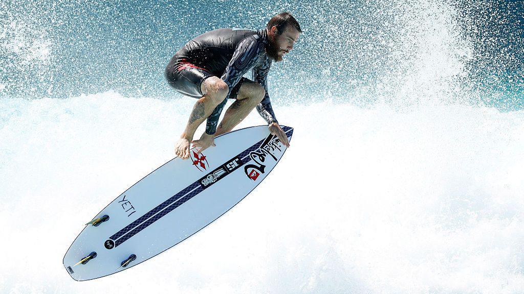 Mikey Wright performs an aerial manoeuvre on a surfboard during the Stab High Sydney in Australia