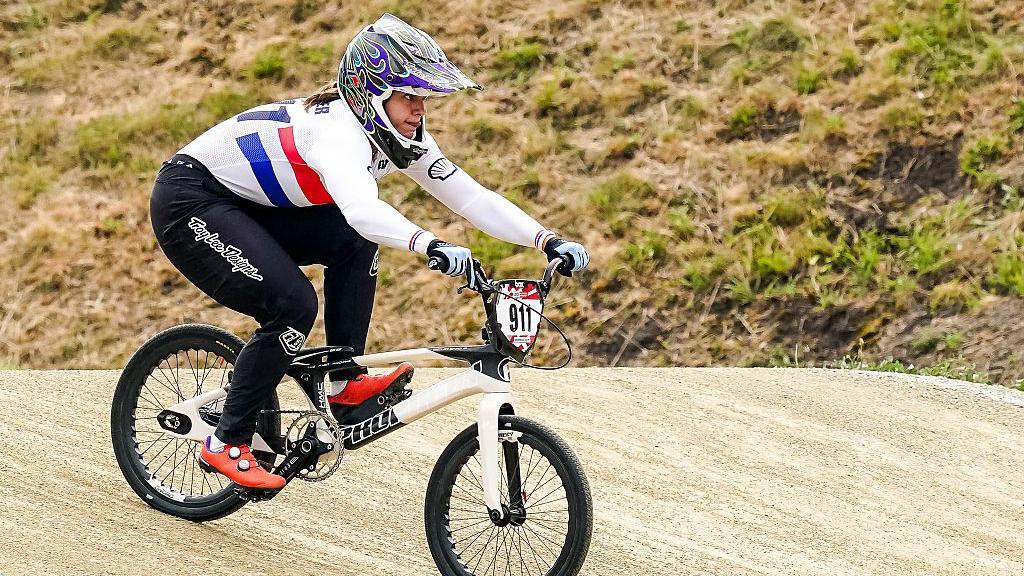 Beth Shriever on her bike riding on a BMX course