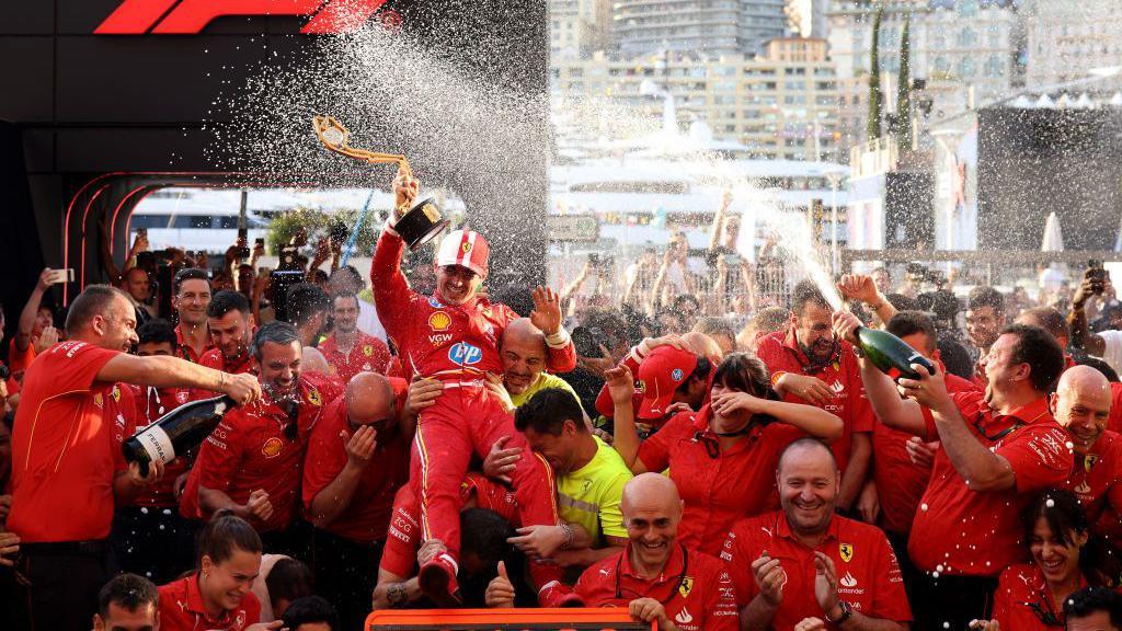 The Ferrari team celebrating Charles Leclerc's Monaco win in 2024