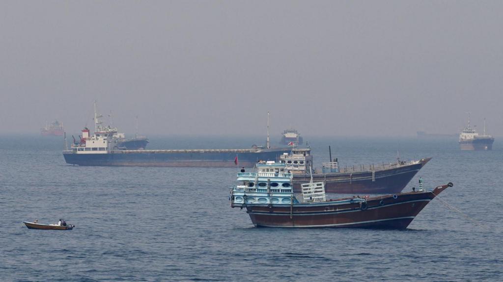 Ships and boats in the Strait of Hormuz off the coast of Musandam, Oman.