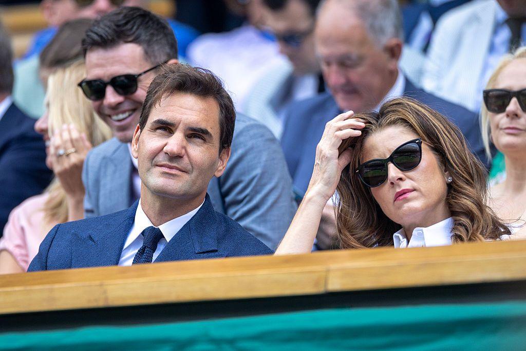 Roger Federer watches on from the Wimbledon Centre Court royal box alongside wife Mirka
