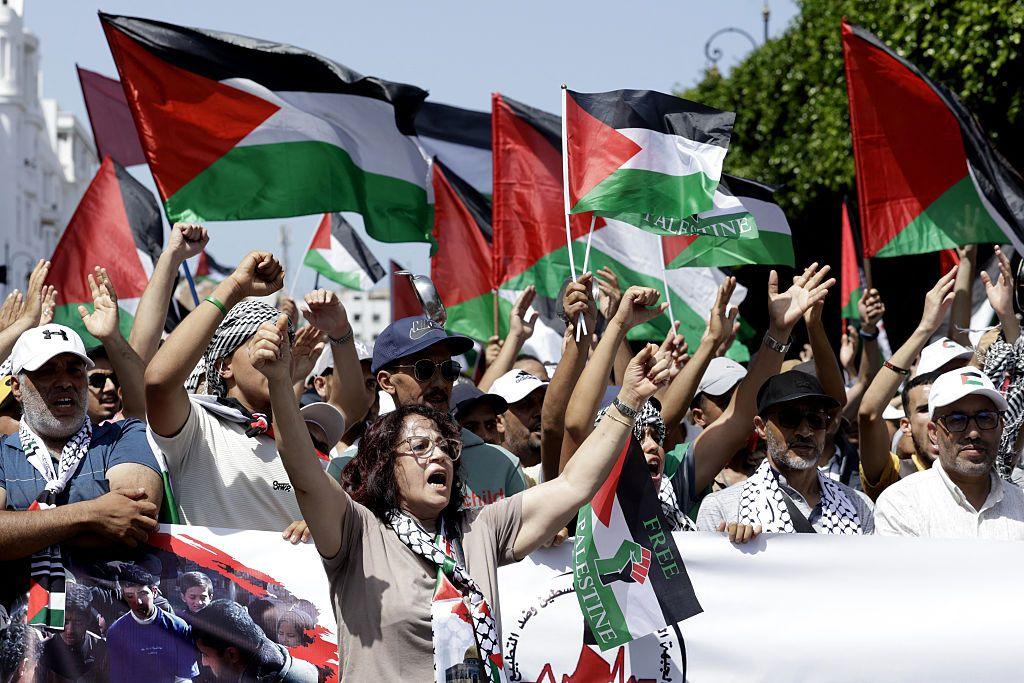 Moroccans chant slogans and wave the Palestinian flag during a march to express their solidarity with the Palestinians in the Gaza Strip, in Rabat.