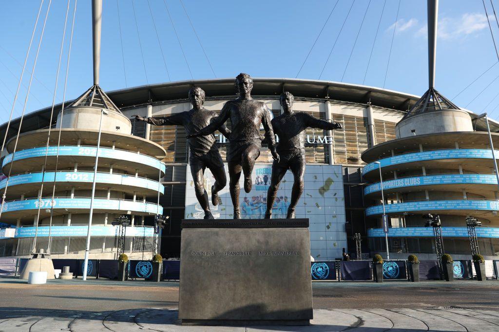 Manchester City's Etihad Stadium with the statue of Colin Bell, Francis Lee and Mike Summerbee in the foreground