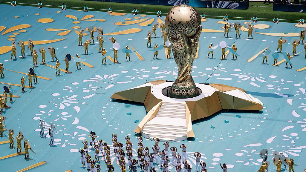 Giant World Cup trophy on stage during the opening ceremony.