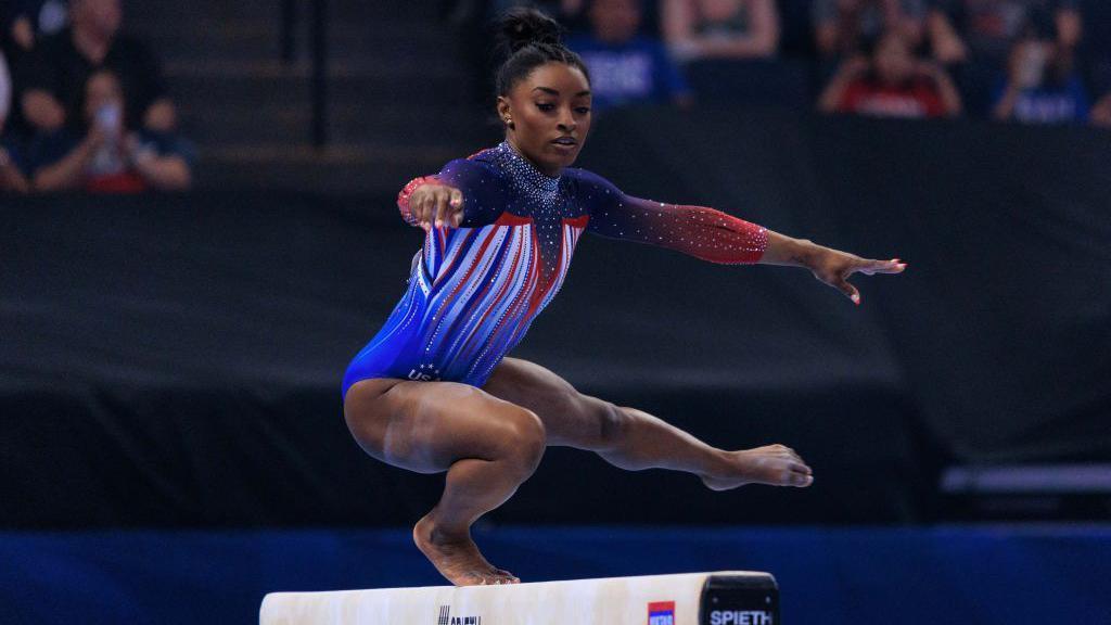 Simone Biles on a beam 