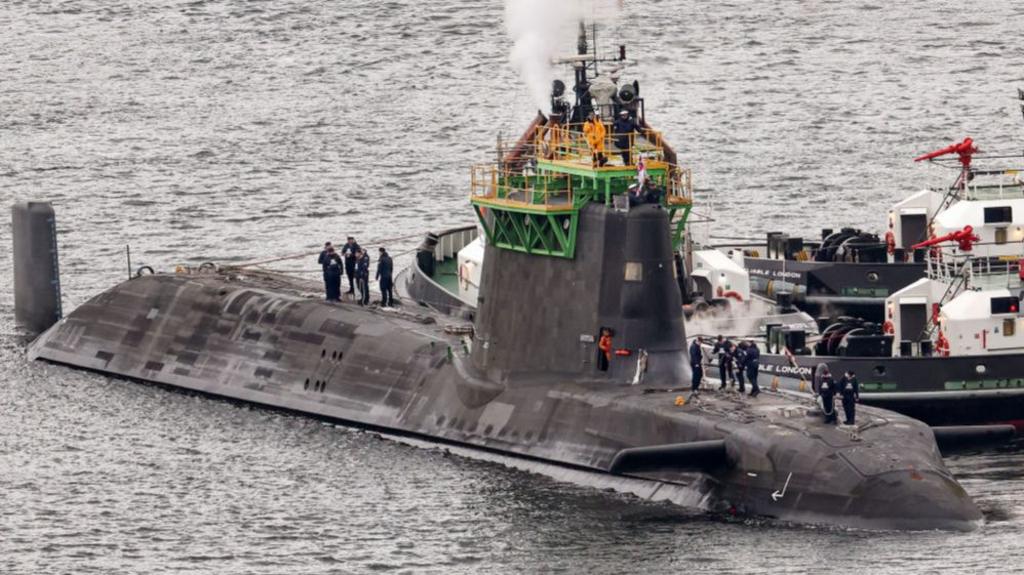 HMS Artful an Astute-class nuclear-powered fleet submarine is manoeuvred at His Majesty's Naval Base Clyde on March 04, 2025 in Faslane, Scotland.