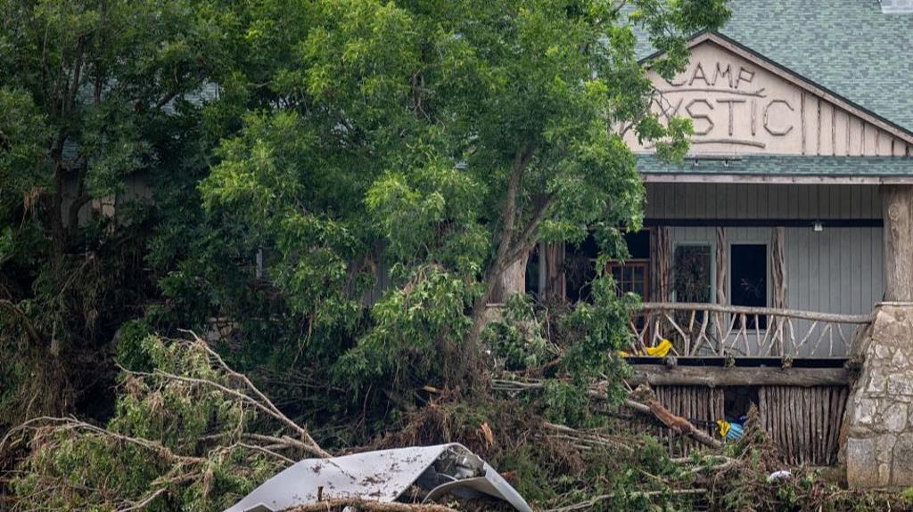 Fallen trees and debris are seen at Camp Mystic after deadly flooding in Texas