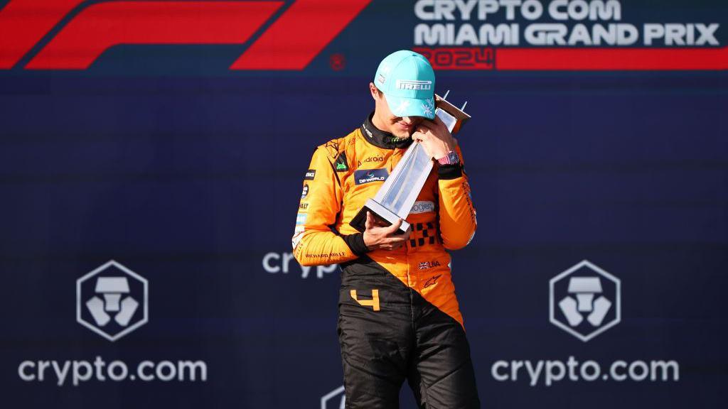 lando norris celebrating on the podium in Miami