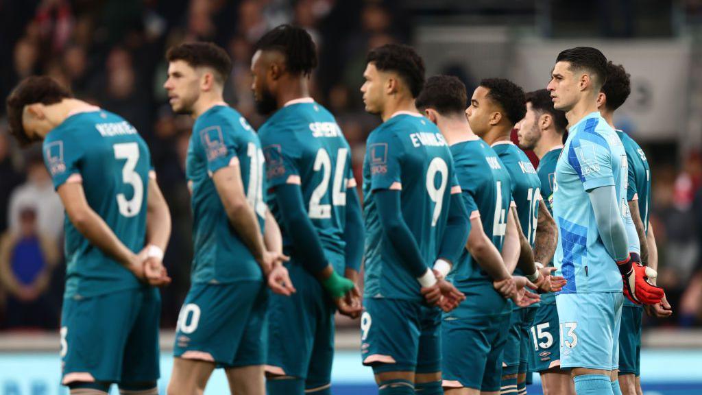 Bournemouth players line up before a match