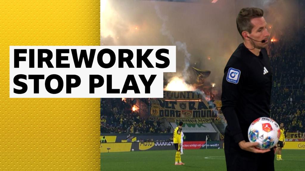 Augsburg v Dortmund halted after fireworks land on pitch Augsburg v Dortmund halted after fireworks land on pitch